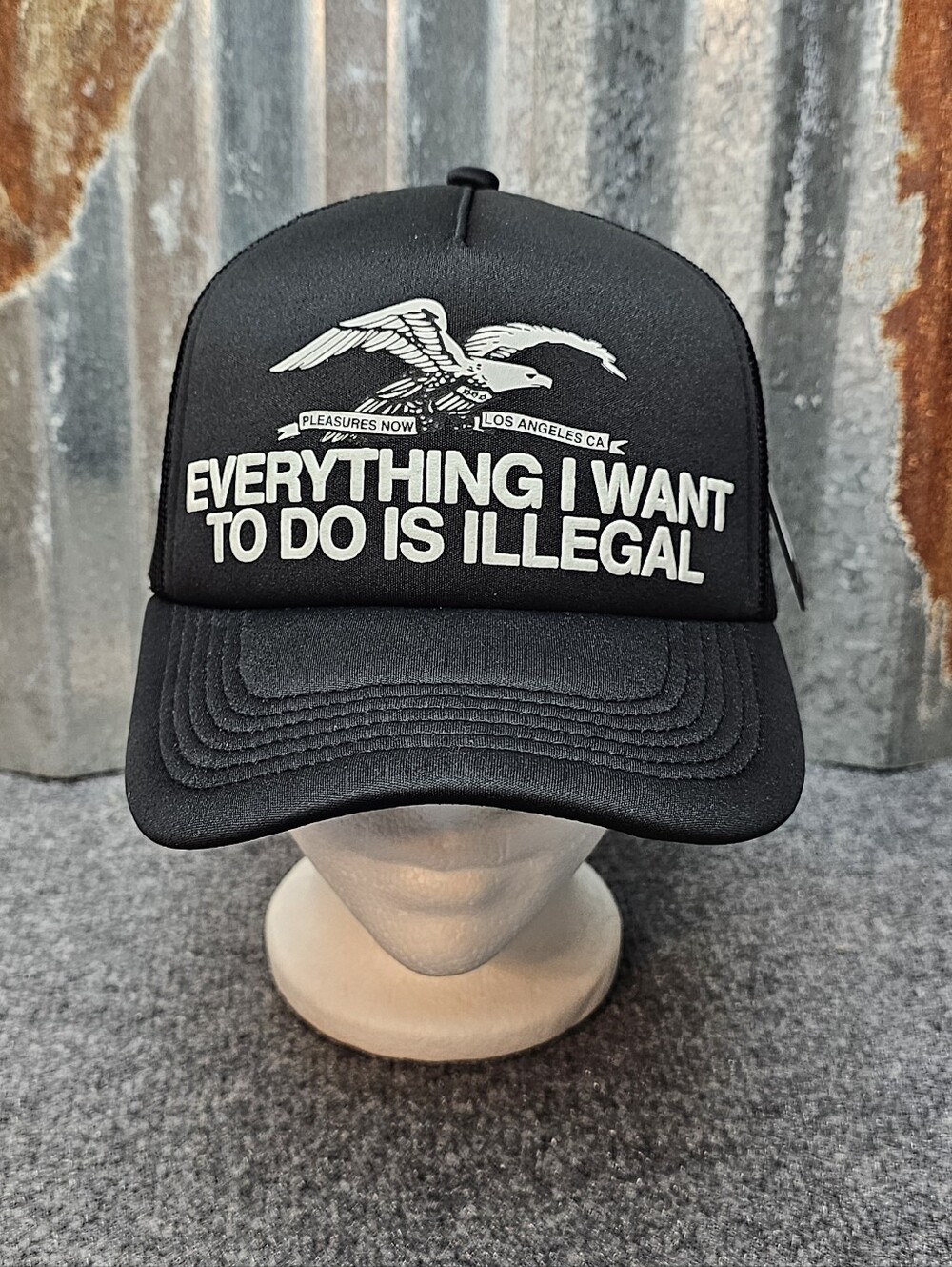 PLEASURES "Everything I Want To Do Is Illegal" Black Trucker Hat- OS